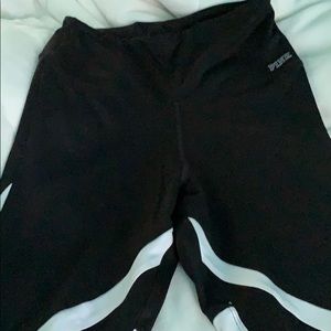 Black leggings with grey and white on the legs.